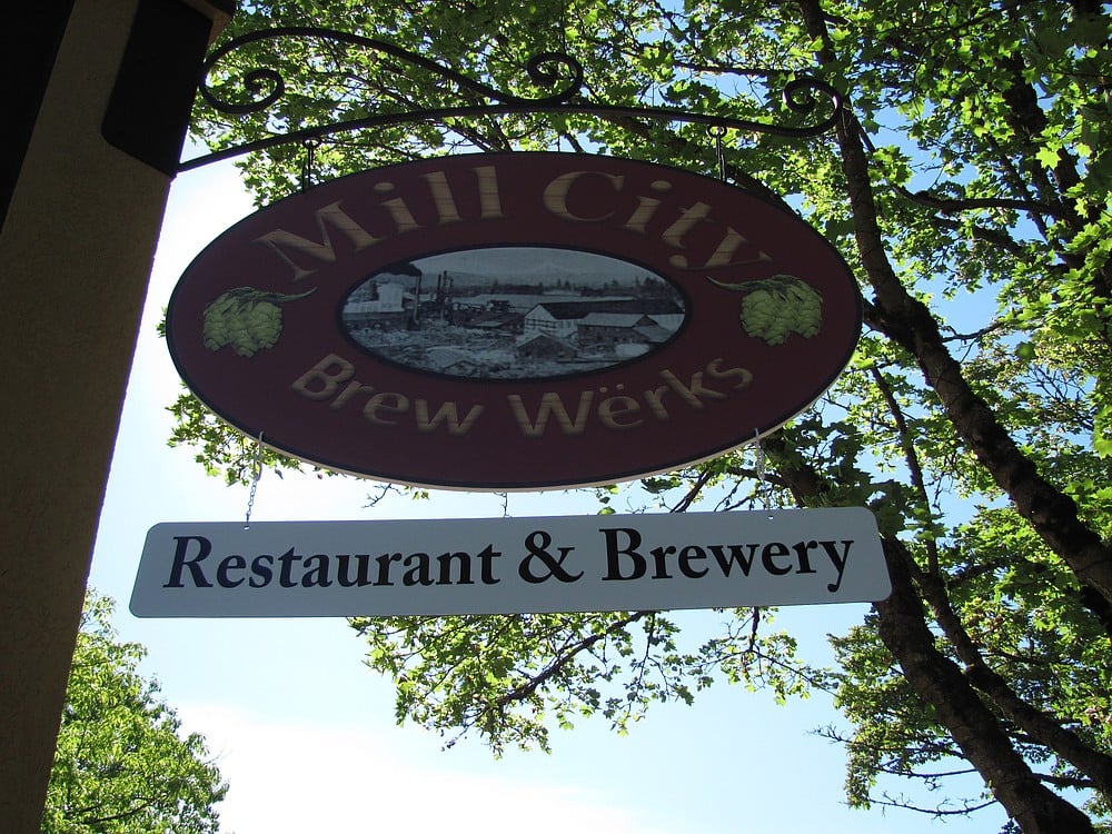 The Mill City Brew Werks sign in  downtown Camas features a historic image of the area.