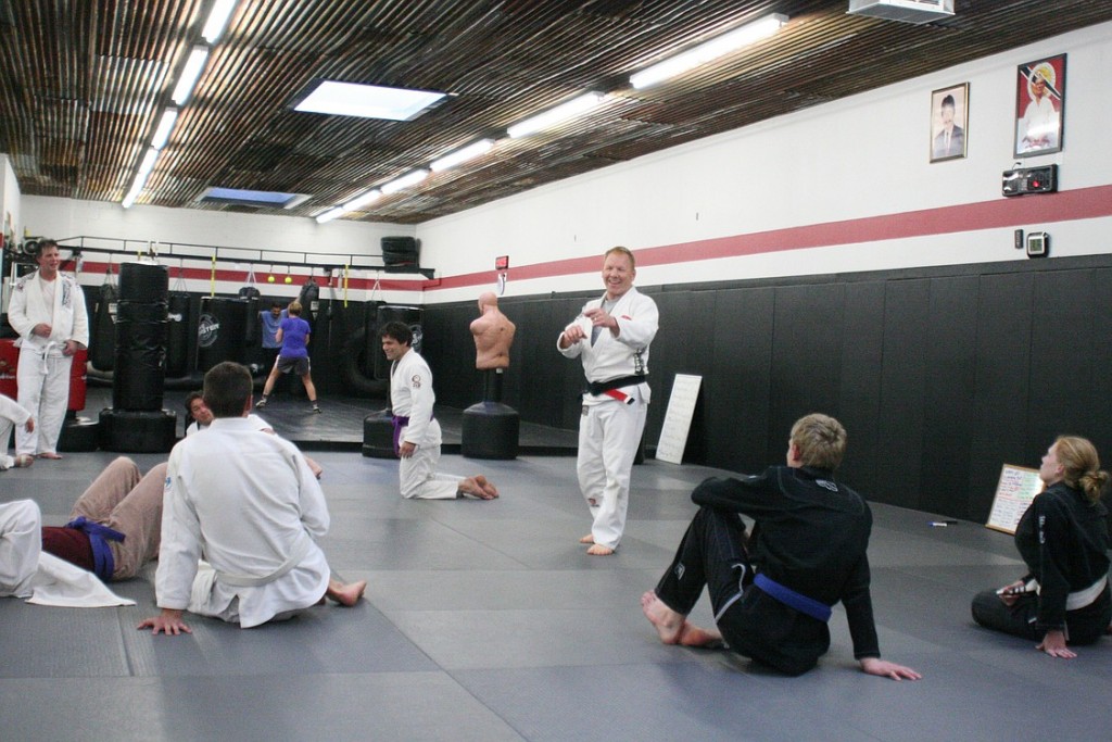 Mel Locke shares a few laughs with his students during an adult Brazilian Jiu Jitsu course he teaches at the Universal Complete Training Center, in Camas.