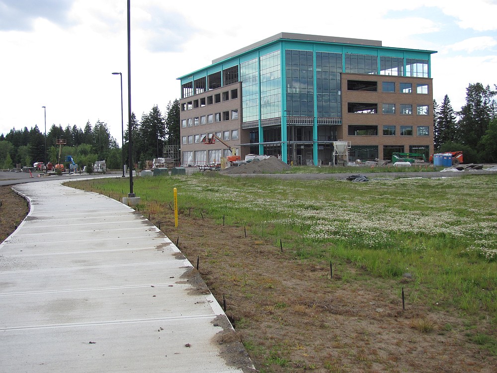 A five-story building under construction in Northwest Camas is expected to be occupied by Fisher Investments this fall. The first four floors will be filled by the 325 workers from the company's satellite office in Vancouver. Camas is being considered by Fisher as a site for its corporate relocation from Northern California. "Camas did everything they could to be friendly," said Ken Fisher, the founder, chairman and CEO of Fisher Investments. "There were joint planning sessions to make things go smoothly. Camas was eager to go. There was 'over the top' coordination in planning and preparation of installation of water, sewer and utilities."