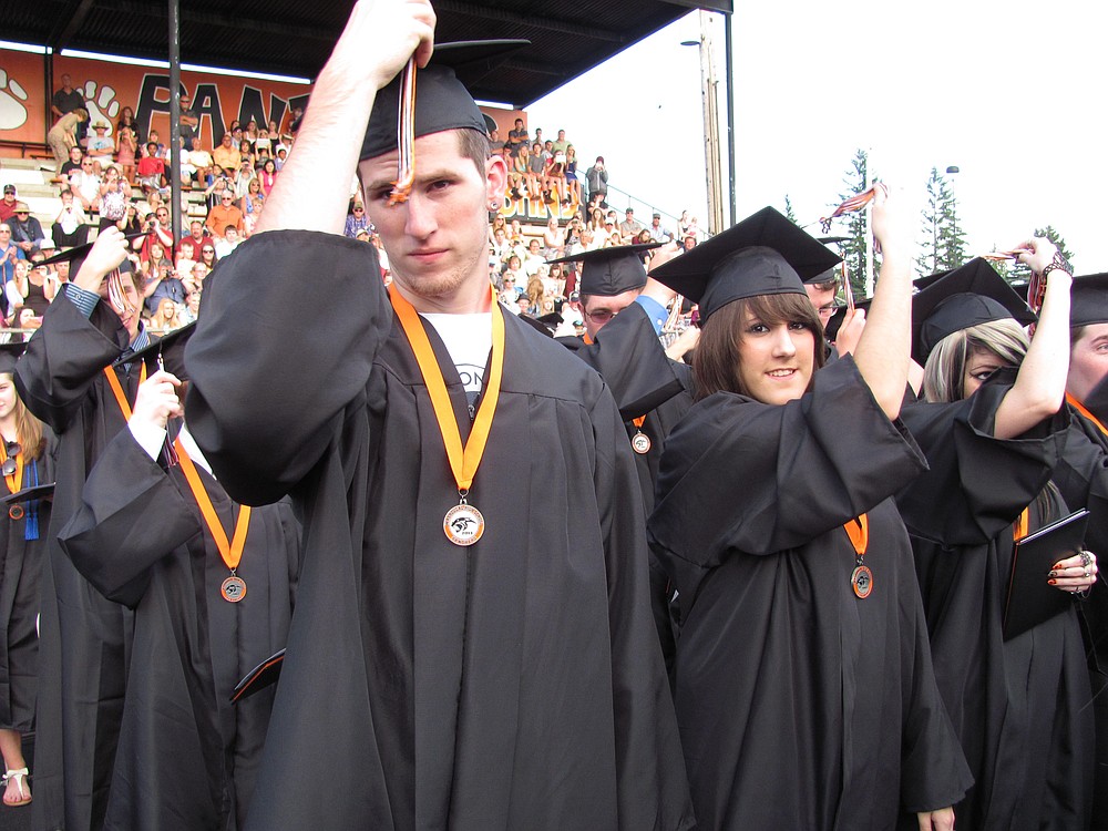 It was time to turn the tassels toward the end of the ceremony. Graduation caps were then tossed in the air and quickly recovered, before the graduates gathered on the field at Fishback Stadium to greet their families and friends.