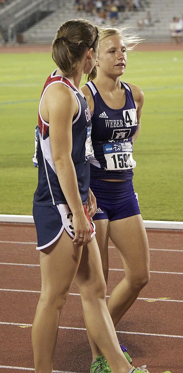 Former Camas cross country teammates Emily Thomas (left) and Kayla Blackford (right) share a moment before running in the 10,000.