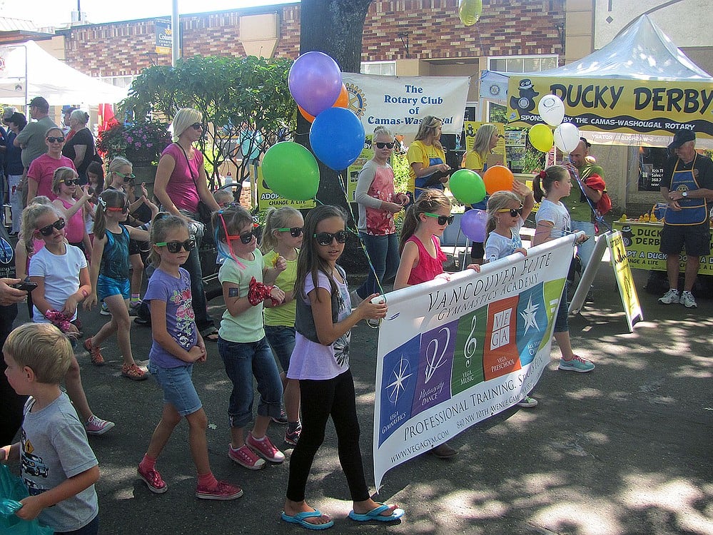 Vancouver Elite Gymnastics Academy members walk in the 2014 Camas Days Kids Parade. The popular annual festival typically draws between 10,000 to 15,000 people to the streets of downtown during the last weekend in July.
