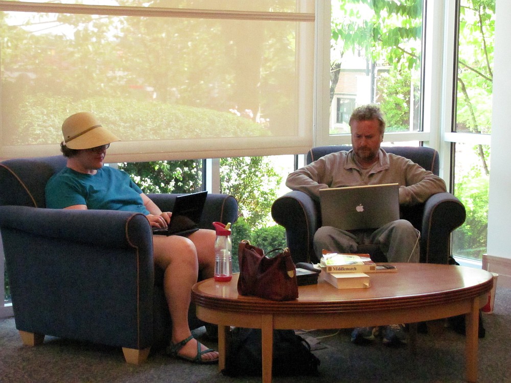 Chrissy Goecks and David Mackie enjoy the air-conditioning and free Wi-Fi at the Camas Public Library.