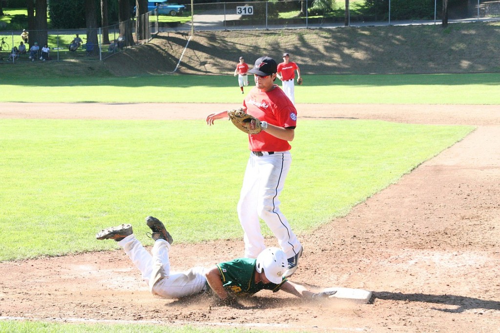 Nate Lauritzen gets down and dirty for the Camas-Washougal Granite against the Vancouver Jayhawks during the semifinals of the Southwest Washington Senior Babe Ruth state tournament Saturday, at Louis Bloch Park in Camas.