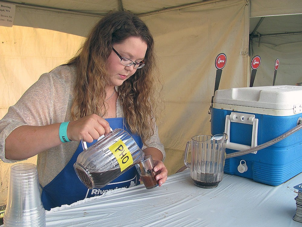 Allysha Moore, a volunteer pourer, was at the Amnesia Brewing booth. "I just enjoy being out and being social," she said. "It's a great event to volunteer for. It's a plus to get free beer." Each volunteer was given a tasting glass and six tickets to try beverages after their shifts were over.