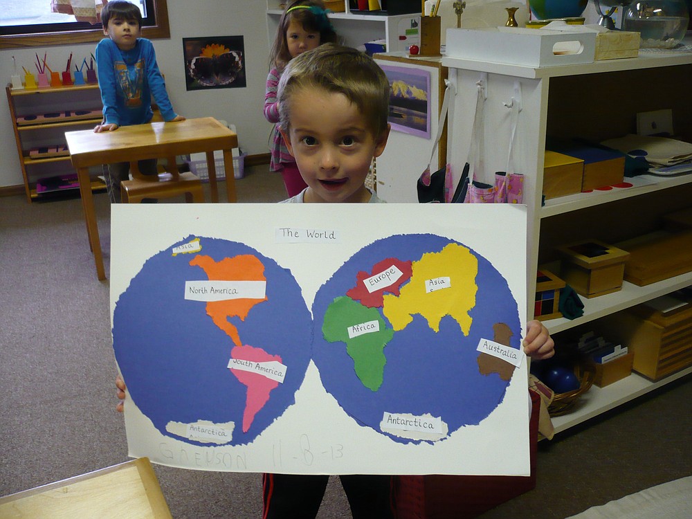 Montessori educational experiences vary in kind and degree so that students are challenged individually. Here, Greyson Becker, 6, displays his geography project.