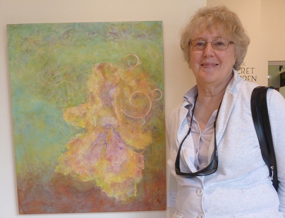 Roxce Stavney, pictured with her piece, "Iris," travels from her home at the Oregon Coast to participate in the Earth, Water and Fire art group.