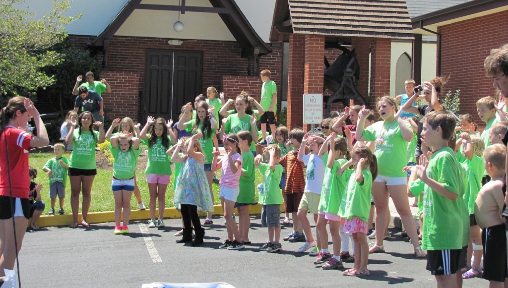 Vacation Bible School attendees rehearse a worship song for their final performance at Zion Lutheran Church. "VBS for students is designed to foster opportunities for young people to know themselves, others and God more," said Bree Truax, youth and Christian education ministries coordinator.