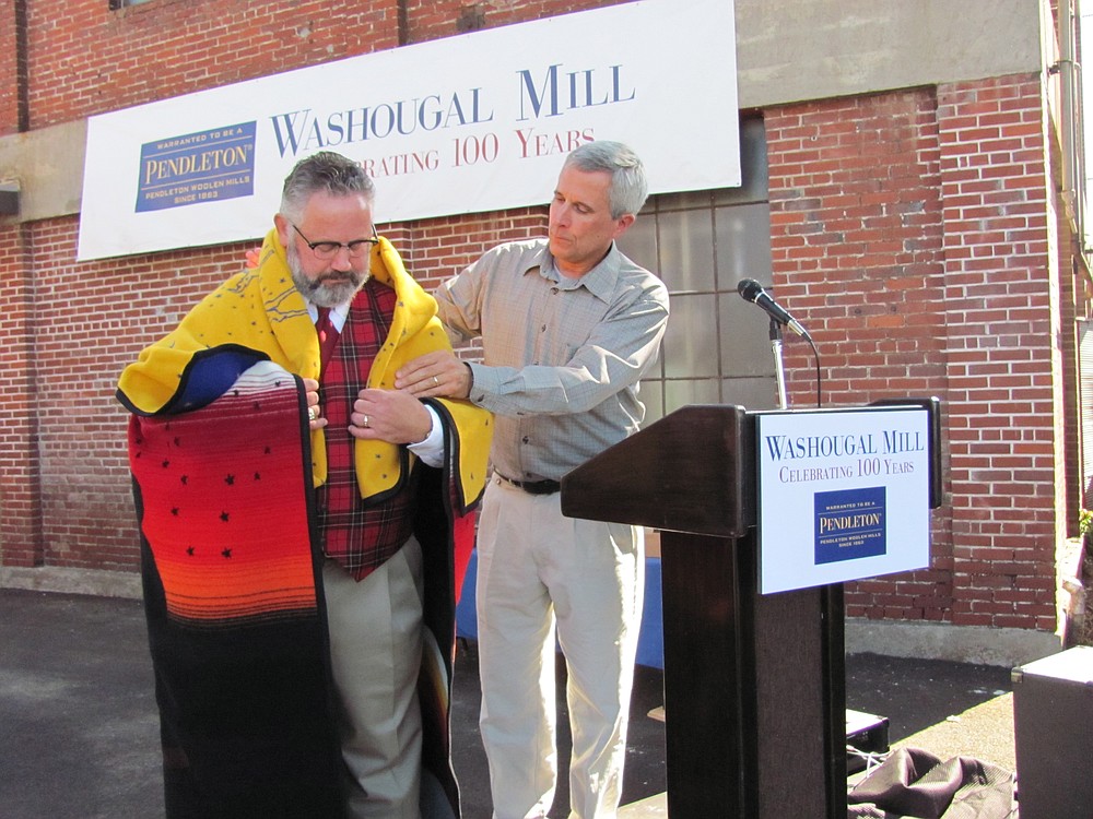Charlie Bishop, vice president of mill operations at Pendleton, presented Washougal Mayor Sean Guard with a ceremonial robe. "It is for important events of achievement and thanks to the community," Bishop said. Earlier, Guard proclaimed Aug. 3 to be "Pendleton Woolen Mill Day."
