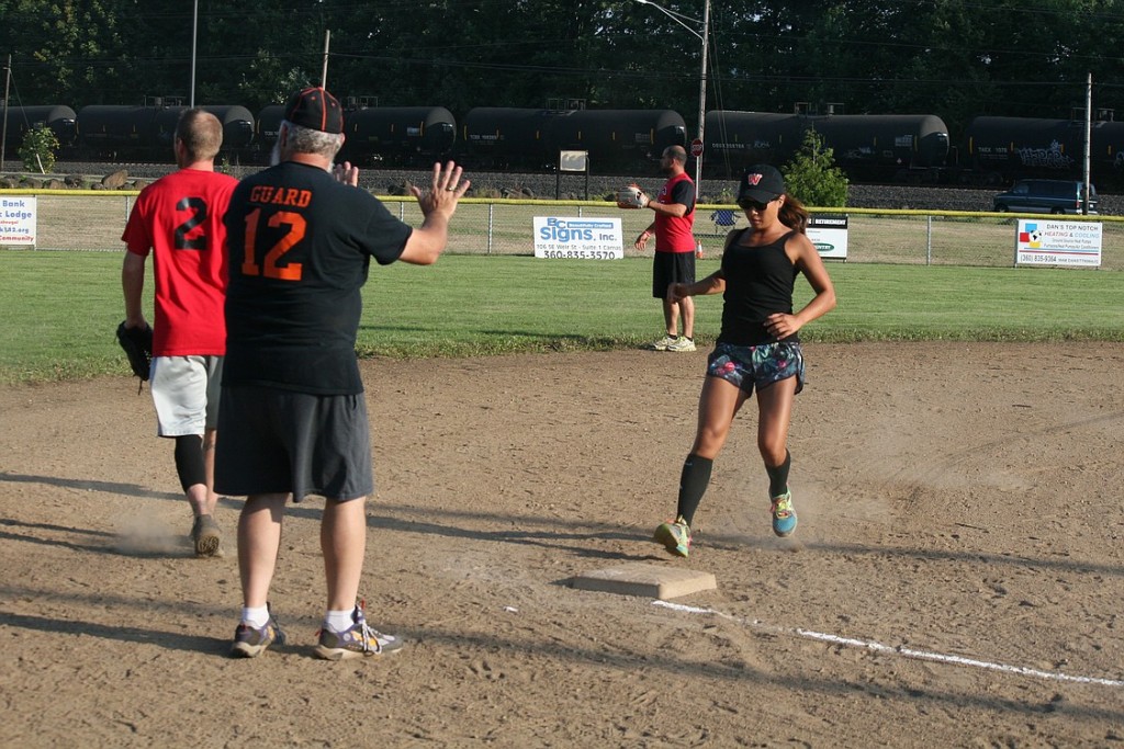 Washougal Mayor Sean Guard motioned Emily White, to stop at third base, Friday night, at the George Schmid Memorial Park Complex, in Washougal.