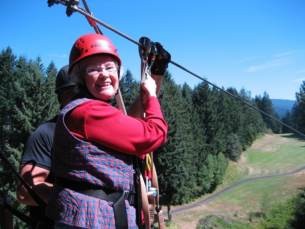 Camas resident Lois Schroeder, 80, prepares to launch on one of the seven zip lines that are part of the Skamania Zip Line Tour in Stevenson. The Camas resident has a fear of bridges, so she was hesitant at first to tackle the adventure. "But by the last zip, I didn't want it to end," she said.