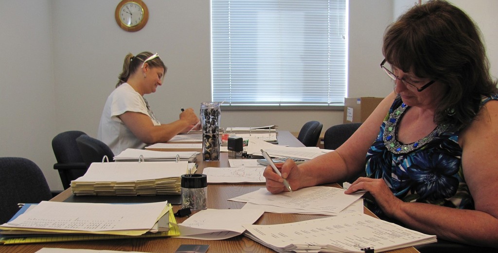 Staff members at the Camas School District transportation department prepare bus routes for the start of the school year on Tuesday, Sept. 4.