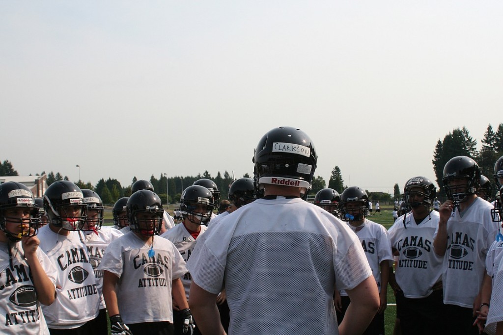 Drew Clarkson leads the Papermakers in a rally cry at the start of football practice Thursday. The 17-year-old Camas High School senior conquered testicular cancer over the summer.