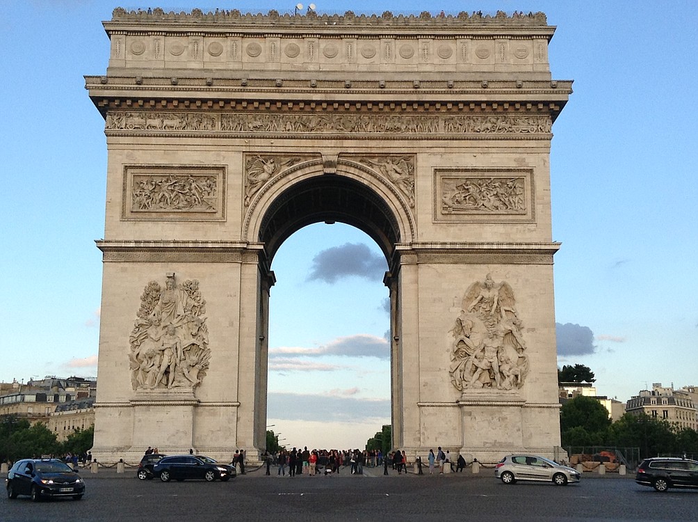 The Arch of Triumph is a monument commemorating the victories of Napoleon. Underneath, in the middle, is the tomb of the unknown soldier.