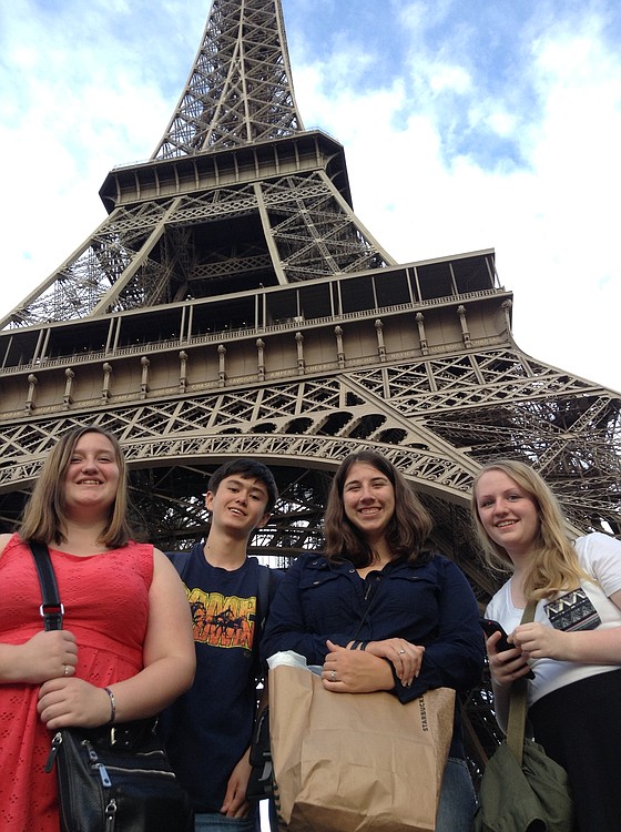 WHS students, from left, Kaycee Zieman, Robby Wayper, Jenni Ladwig and Alex Carstens, pose in front of  France's iconic landmark, the Eiffel Tower, during an eight day trip to France this summer.