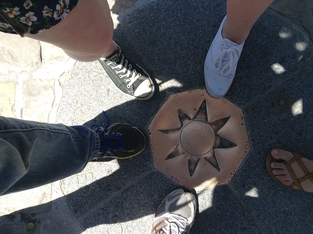 WHS students Kaycee Zieman, Jenni Ladwig, Alex Carstens, Robby Wayper and teacher Craig Grable put their feet at Point Zero  in front of Notre Dame Cathedral in Paris. "It is said that if you stand on this spot you are destined to return to Paris," said Grable. "It has worked pretty well for me."