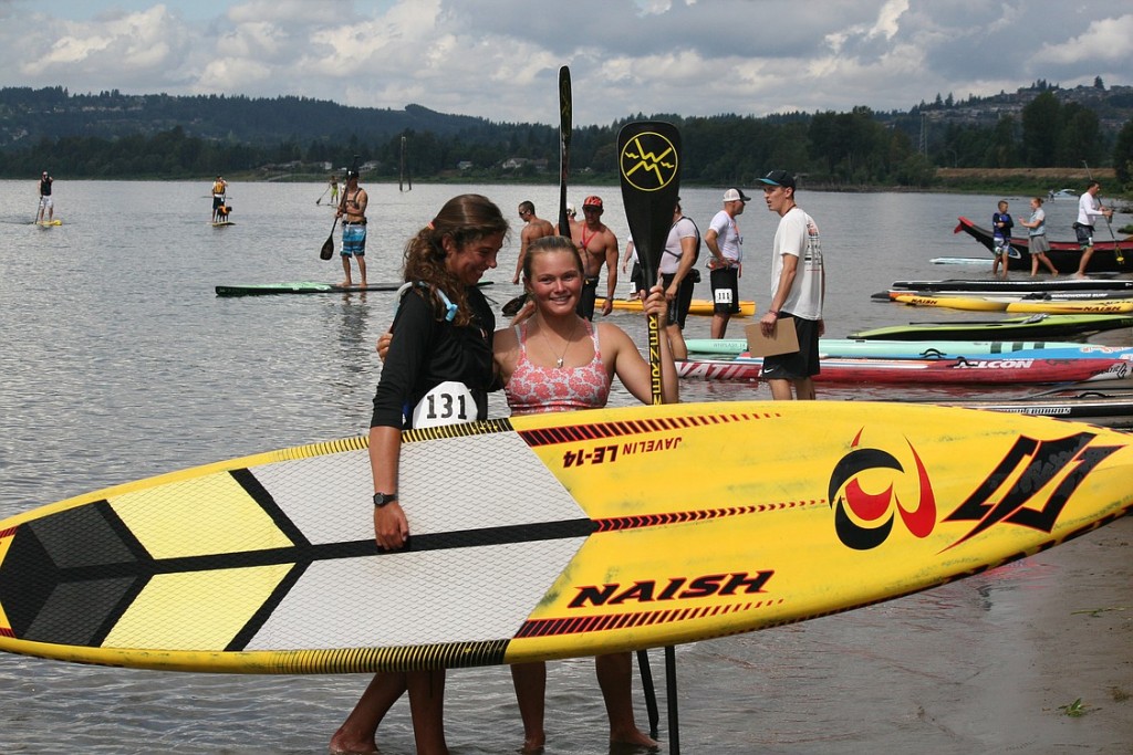 Professionals Hannah Hill and Fiona Wylde celebrate on the shore at Cottonwood Beach.