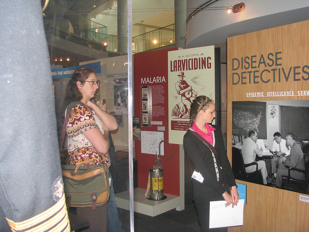 Dean and Fadlovich browse information about the real "Disease Detectives" during their visit to CDC.