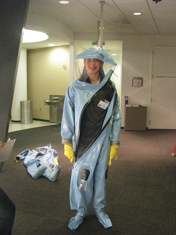 Marcuc Bintz tests out a protective suit worn by the "Disease Detectives" at the CDC.