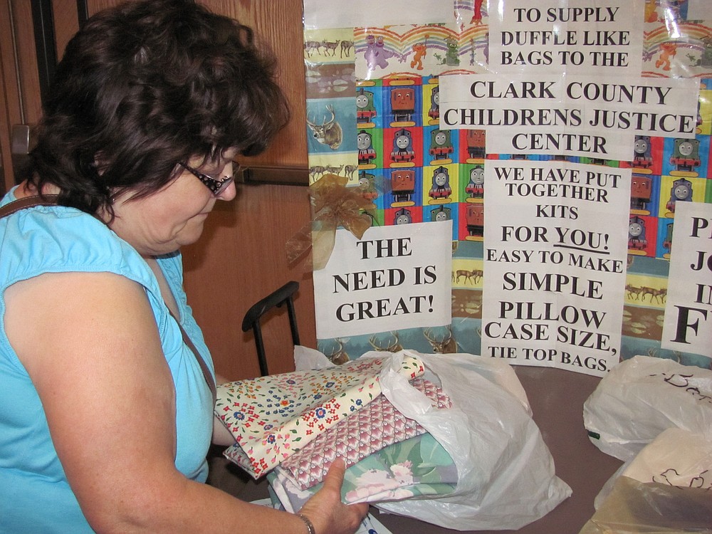 Marilyn Price (pictured) and Georgia Hockett are part of the "Baggettes" group at the Clark County Quilters Guild. They make cloth bags and baby quilts for the Children's Justice Center in Vancouver. "When children are removed from a home, they often have to put their belongings in a plastic bag," Price said. "We give them handmade cloth bags to use instead."