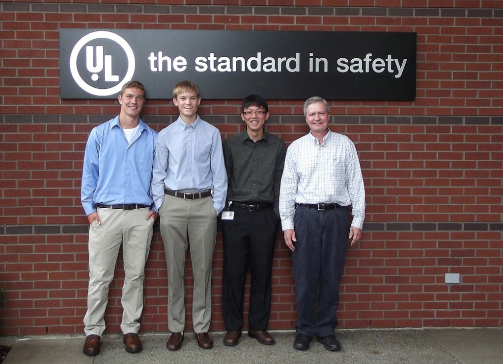 Matt Palodichuk, Zach Hein and Xinyang Chen helped develop a new software program to streamline product testing time estimates for Underwriters Laboratories. They were assisted by mentor and lead engineer Scott Varner (far right).
