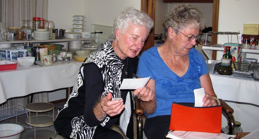 Soroptimists Marilyn Brown (right) and Marjorie Rorabaugh discuss pricing during a recent estate sale in Washougal.