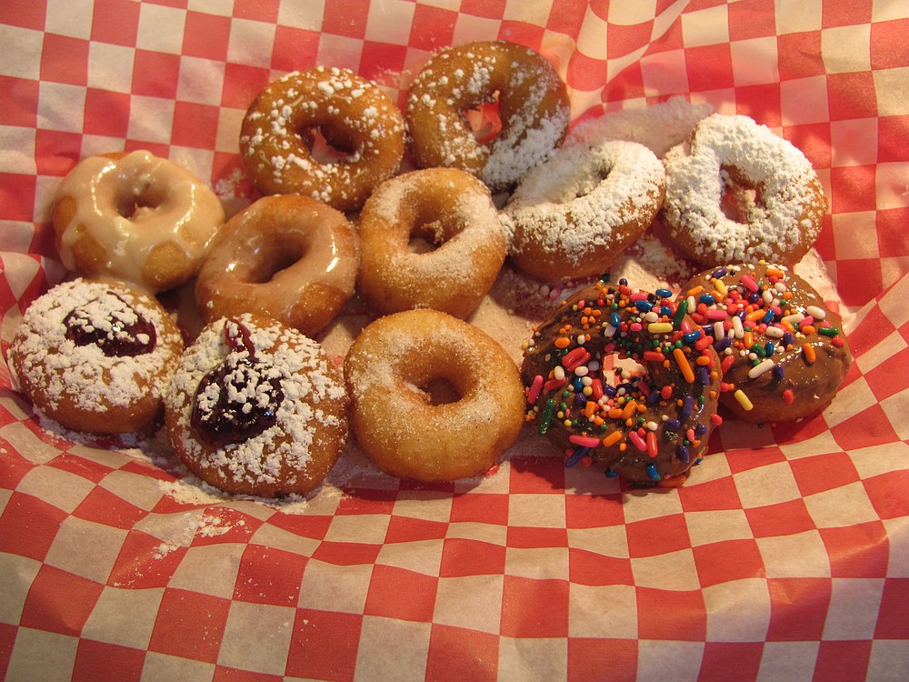 Doughnut topping options include berry jam, chocolate and sprinkles, sugar and cinnamon, powdered sugar, salted caramel, maple icing and sweet chili sauce.