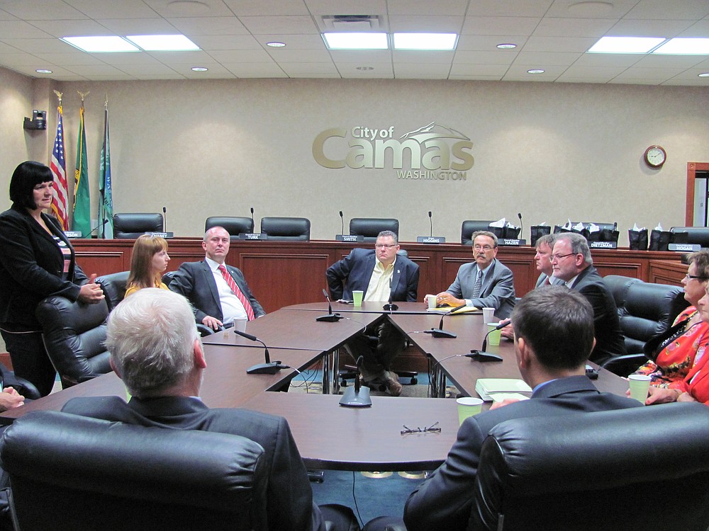 Delegates listen to Higgins and retired city administrator Lloyd Halverson discuss how Camas leaders in the 1970s and 1980s developed Camas from a small mill town into a diverse, mostly high-tech economy. "The story is interesting and may be applicable elsewhere," Halverson said.