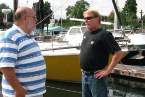 Mark Hamrick, Port of Camas-Washougal harbormaster (right) chats with Tom Welinski, of Camas (left), at the port marina. In August, Hamrick provided transportation and assistance when Welinski pulled a muscle in his back while sailboating. Hamrick said every day brings a new challenge. "You never really know what's going to happen when you go to work or when you're not there for that matter," he said. "Your phone can ring at any time for almost anything. It can get exciting at times, or go for days or weeks without an event." Hamrick was hired by the port in 2005, in the role of maintenance assistant. He was promoted two years later.