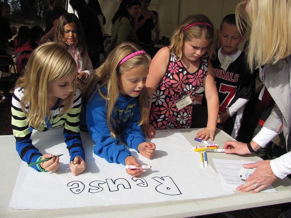 Prune Hill Elementary School students brainstorm definitions of "reuse" during the festival, which brought 1,000 kids to the park last Thursday and Friday.