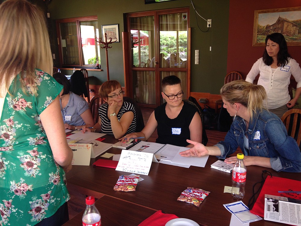 Liberty Middle School teacher Lexi Loveland explains an activity to Polish teachers at a professional development workshop during the first week of  summer English Language Camp in Poland.