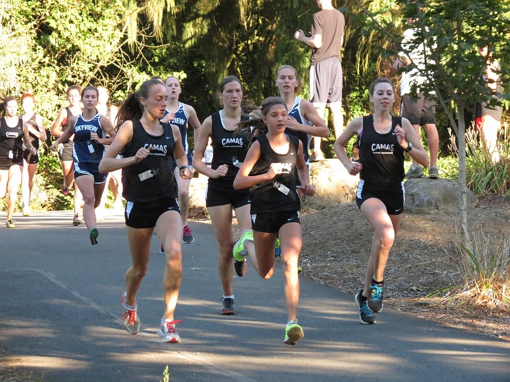 Papermaker runners Alexa Efraimson, Camille Parsons, Maddie Woodson and Alissa Pudlitzke get the upper hand on Skyview Oct. 2, on the Heritage Trail at Lacamas Lake. Eight Camas runners crossed the finish line before the first one from Skyview.