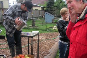 Attendees at Spooky Harvest enjoy homemade apple cider, one of several complimentary treats at the Camas Camp-n-Ranch event.