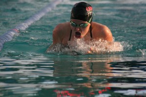 Corrine Bintz cuts through the water as the sun shines on her back Wednesday, at the Grass Valley Aquatics Center. The CHS sophomore finished first in the 200-meter medley relay, the 200 freestyle, the 200 freestyle relay and the 100 breaststroke (above).
