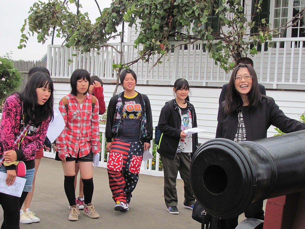 One of the activities the Taki delegation participated in was a tour of historic Fort Vancouver. Here, they learn about the cannons outside Chief Factor's house.