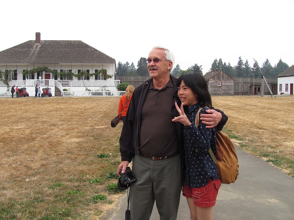Ken Mattson poses for a photo with a Taki delegate during a tour of Fort Vancouver last week. The middle school students and city officials were in Camas from Saturday to Wednesday morning last week.