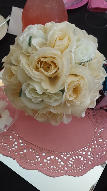 White roses, with carafes of pink lemonade, were part of the table decor at the Pink Tea Party.