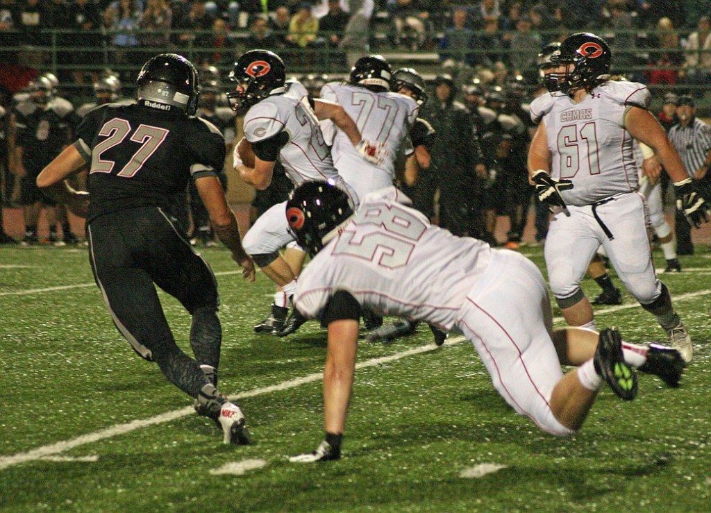 Camas running back Cole Zarcone runs through a giant gap created by linemen Dakota Napierkowski, Chase Lea and Alex Walker Friday, at McKenzie Stadium. Zarcone scored three touchdowns to help the Papermakers beat Union 37-20.