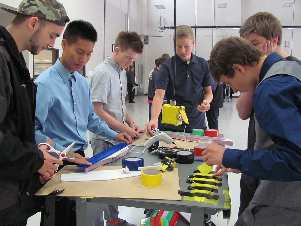Ryan Burden (third from left, clockwise), a senior at Washougal High School, works with other students at the Clark County Skills Center aviation program. Burden wants to be a pilot and is hoping this program helps prepare him for the future.