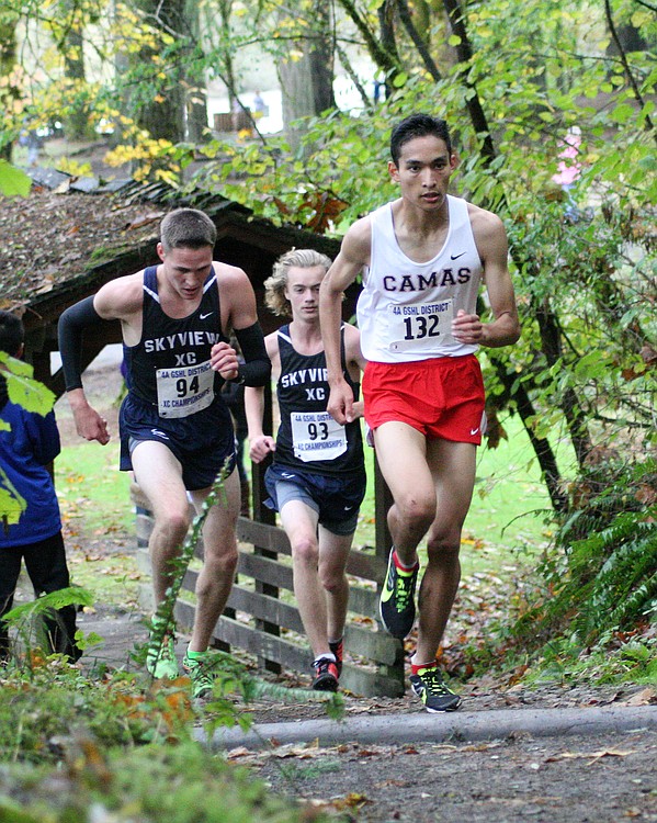 Said Guermali asends to the lead in the district boys championship race. The Camas High School senior crossed the finish line first with a time of  16:04.