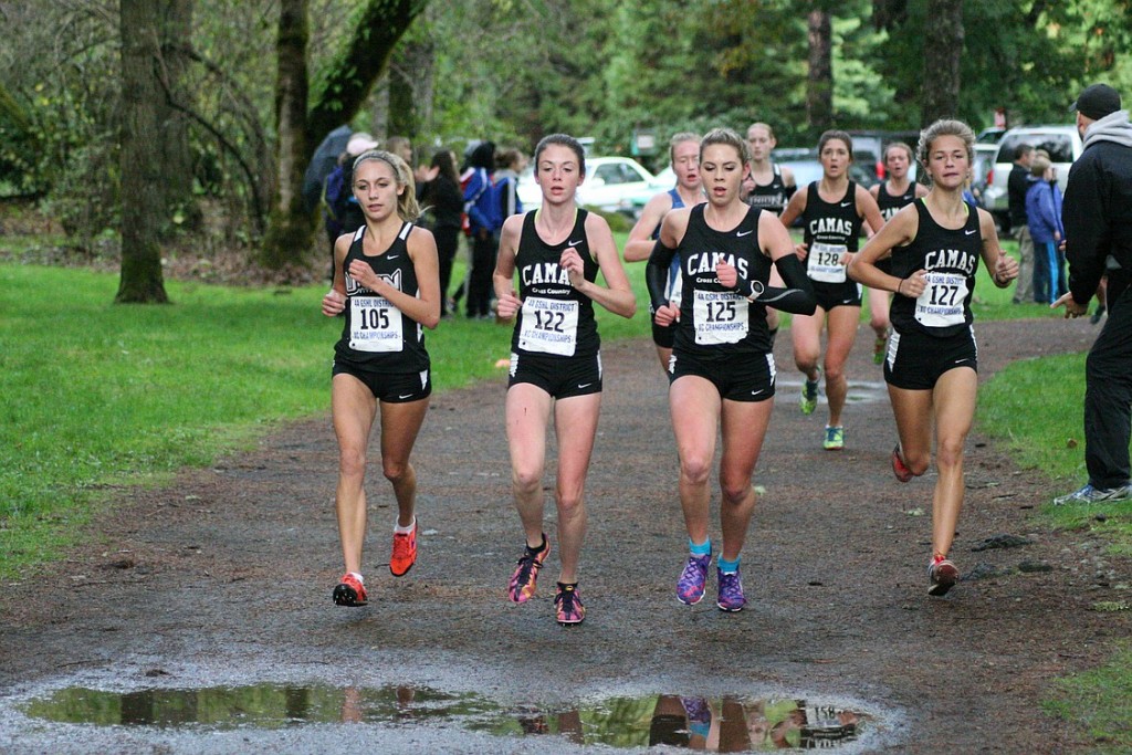 Camas High School cross country runners Emma Jenkins, Alissa Pudlitzke and Emily Wilson lead the pack with Union's Alexis Fuller during the district championship race Thursday, at Lewisville Park in Battle Ground.