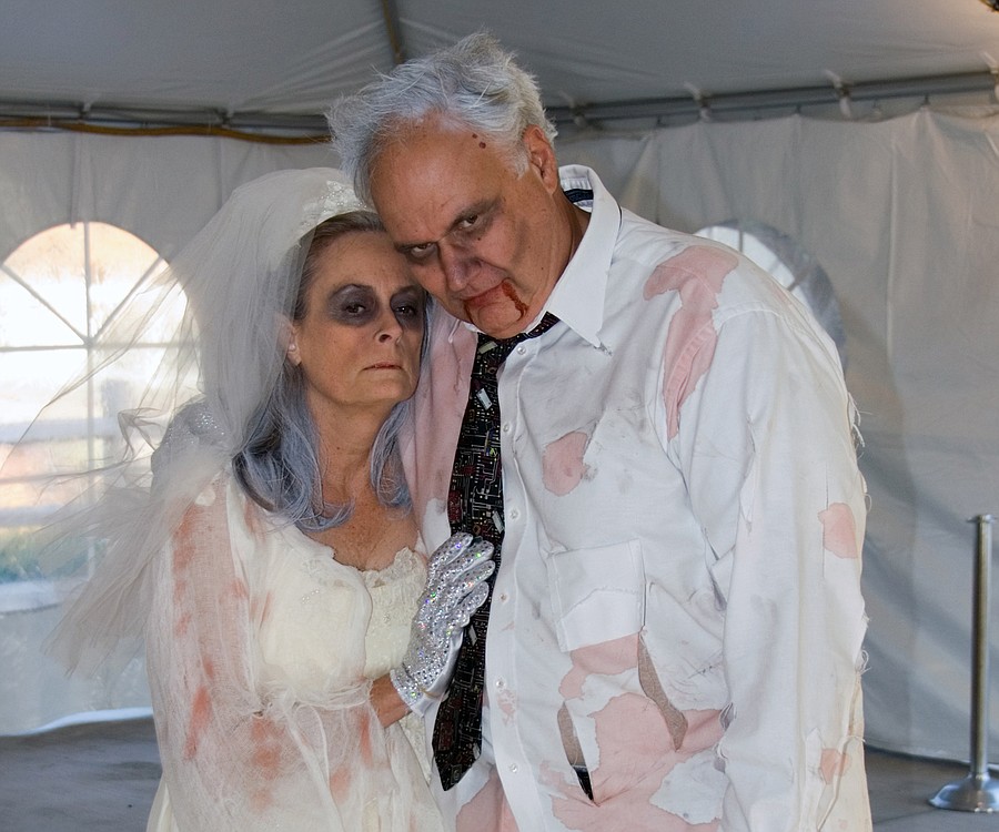 "Zombie bride and groom," Linda and Mike Harnish enjoy the festivities during a performance at Camas Meadows.