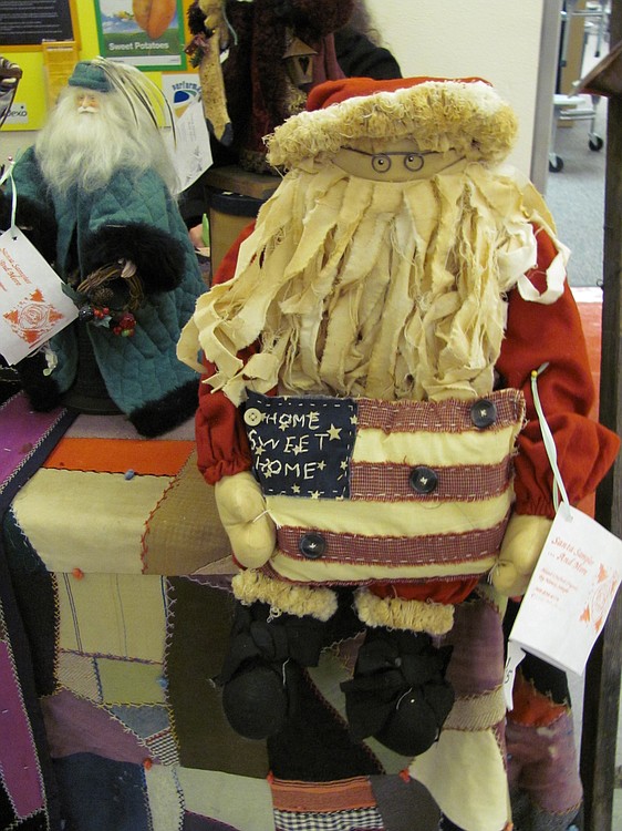 Handcrafted Santa Claus dolls are on sale at area bazaars.