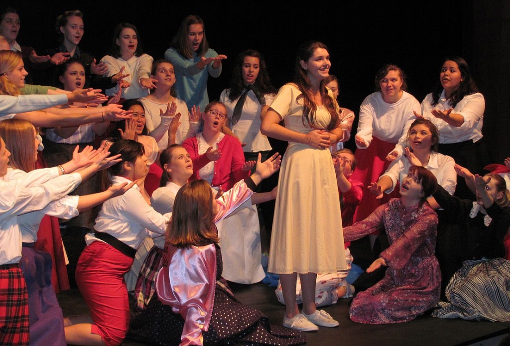 Sandy (Liza Hess ) sings of her summer with Danny while the girls demand more information. The WHS production of "Grease" will include a sock hop before each performance, where the audience can be on stage and dance with the cast.