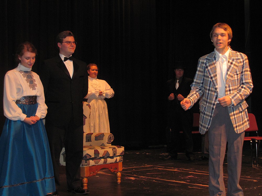 Barnaby, right, (Schroeder) tells the audience about the moral of the play while, left to right, Dolly Levi (Jessica Hatton), Horace Vandergelder (Lively), the cook (Rebecca Bennett) and the cabman (Tristan Fackler) look on.