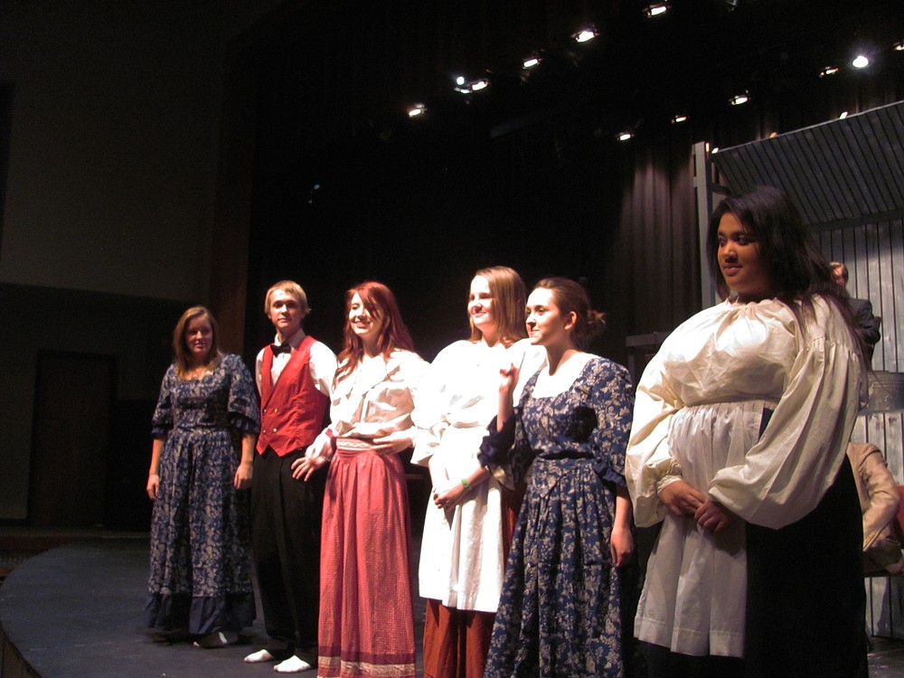 The ensemble, left to right, Keira Stogin, Riley Miller, Shannon Leininger, Holly Erickson, Jamie Szysplinski and Courtney Burton address the audience at the opening of a scene.