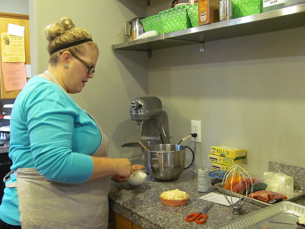 Koch puts the finishing touches on a gluten-free pumpkin mousse tart. Her boutique baking business caters to small cafes, restaurants and individuals. She has been baking gluten-free versions of several items since starting her business seven years ago.