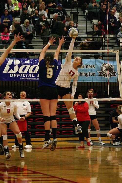 Carly Banks blasts the ball beyond the front line for a Camas point.