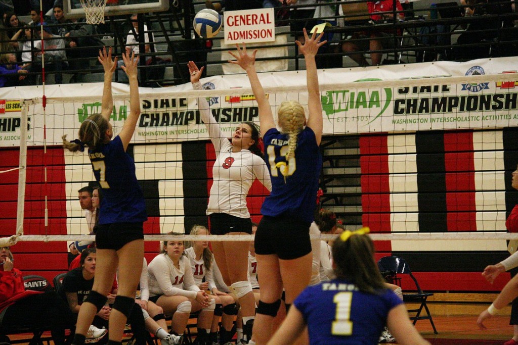 Lauren Harris rises up to smash the volleyball for the Papermakers during the trophy match against Tahoma.