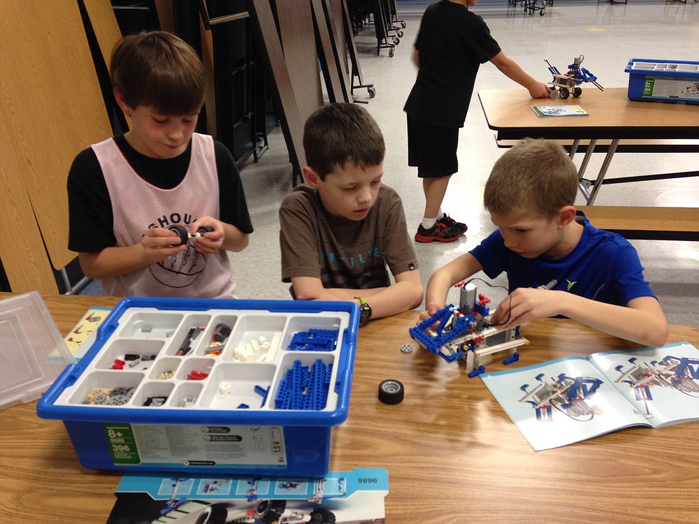 Alex Holden, Owen Dornbusch and Tanner Hopkins collaborate on a build during Lego Engineering class.